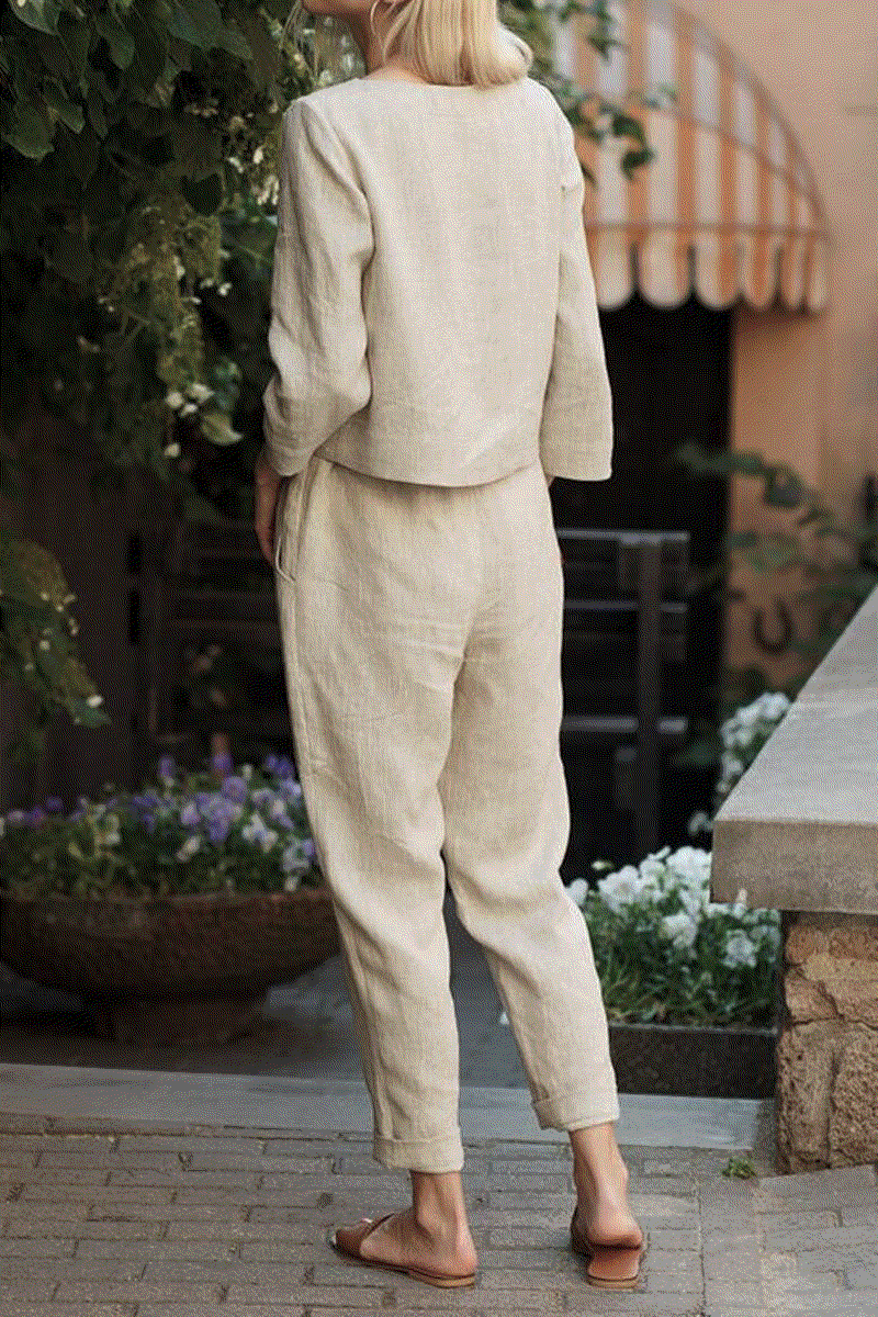 Woman wearing relaxed cotton-linen monochrome longline top and wide-leg pants set outdoors