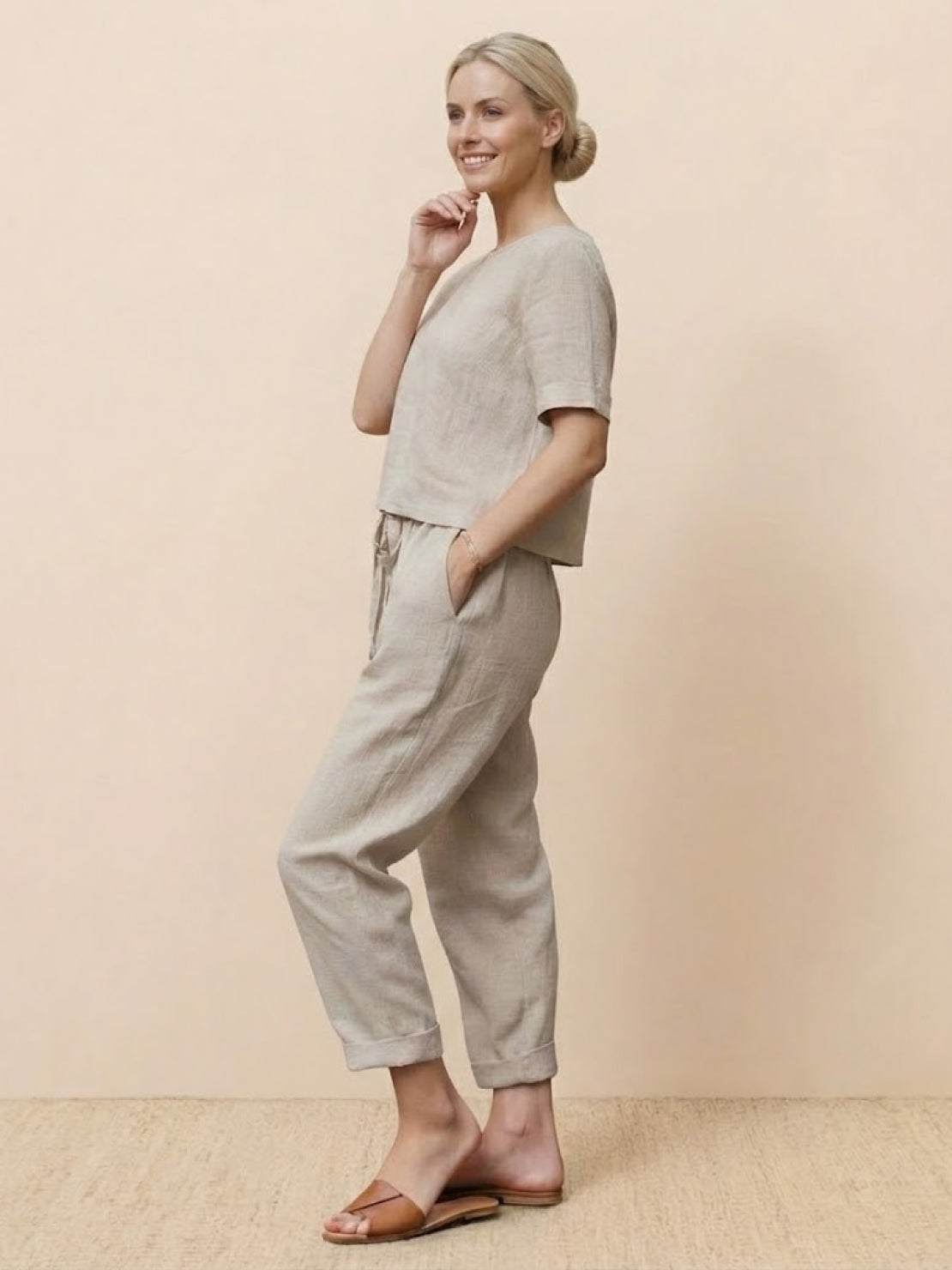 Woman wearing relaxed fit 100% cotton linen monochrome set with short-sleeve top and straight-leg pants