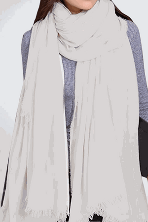 Lightweight eco-linen Color-POP Scarf in soft white, styled with casual outfit for all-weather warmth and breathability