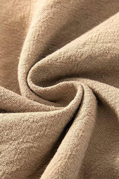 Close-up of beige high-waist cotton linen fabric texture for palazzo pants
