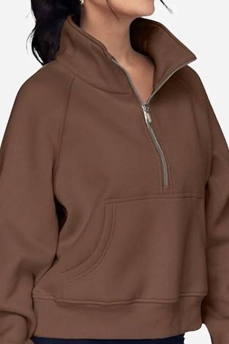 Cozy oversized half-zip fleece pullover sweatshirt in brown with a front pocket and relaxed fit