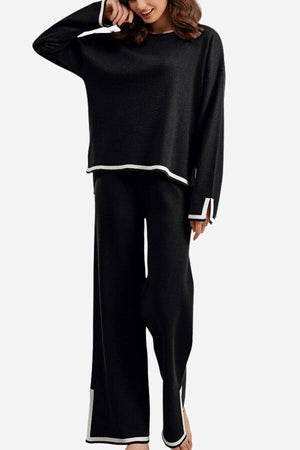 Long sleeved relaxed fit black two-piece lounge set with white trim and wide-leg pants