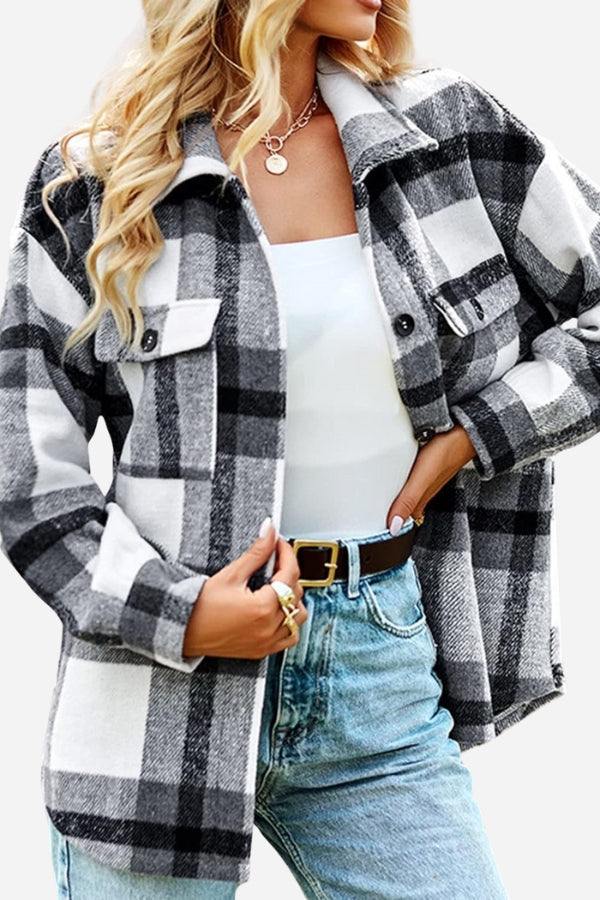 woman wearing comfy flannel classic black and white checkered button-down shirt with pockets and light blue jeans