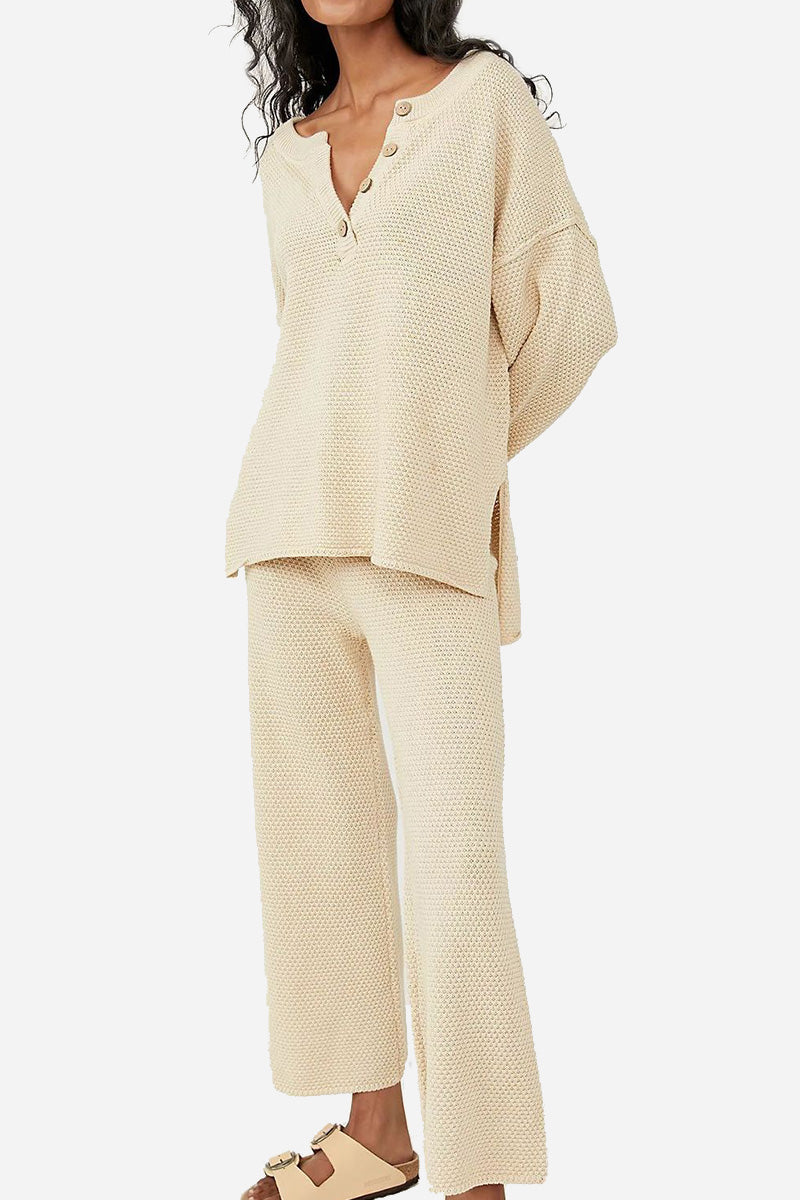 Woman wearing beige two-piece oversized set with long sleeves and wide pants for multi-weather comfort