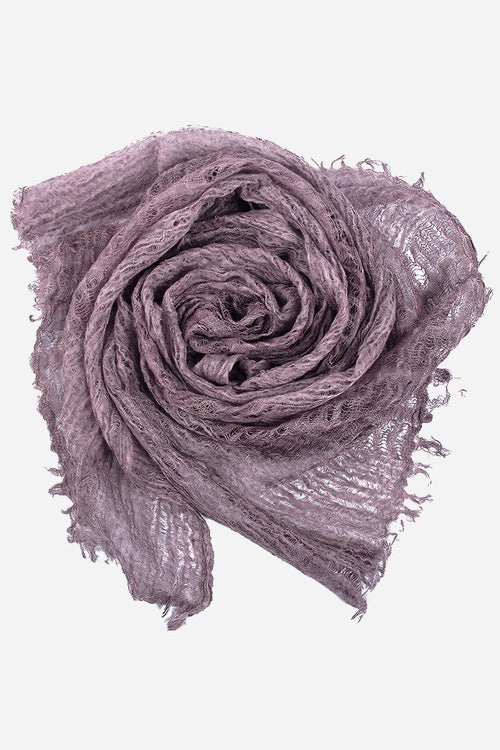 Lightweight linen scarf in soft purple with frayed edges, breathable and versatile accessory.