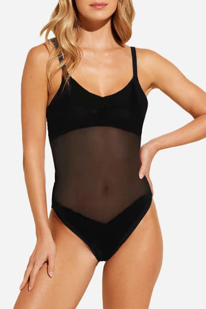 Black mesh tan-through one piece swimsuit with adjustable straps and sheer midsection panel for even sun tanning.