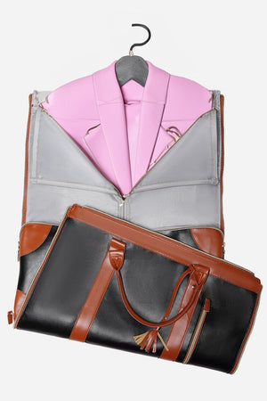 Foldable no-wrinkle travel bag in black and brown PU leather with a pink blazer inside, designed for wrinkle-free garment storage and easy transport.