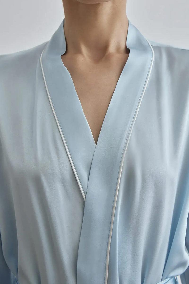 Close-up of light blue Mulberry Silk Nightgown with white piping and relaxed fit collar