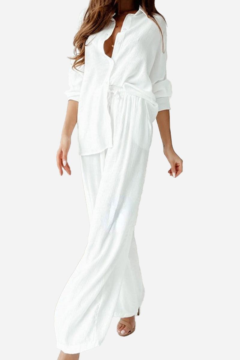 Elegant white professional two-piece set with long sleeves and relaxed fit pants