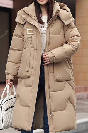 Beige FrostLine Long Coat winter travel coat with hood and insulated design for cold weather warmth.