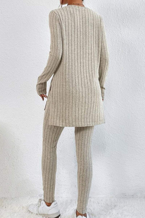Back view of a woman wearing Butter Touch Ribbed Two-Piece Set in beige ribbed fabric with long tunic top and fitted leggings.