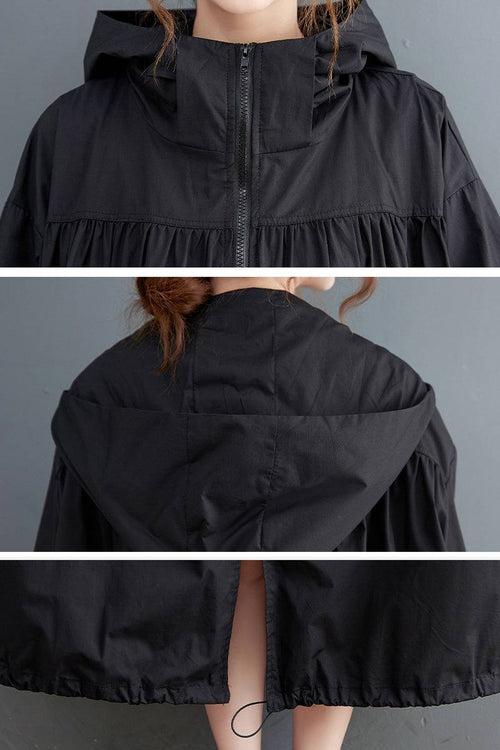 black oversized all-weather water-resistant windbreaker with hood and front zipper closure