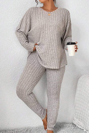 Woman wearing a beige Body Confident Oversized Knit two-piece set with ribbed texture holding a coffee cup.