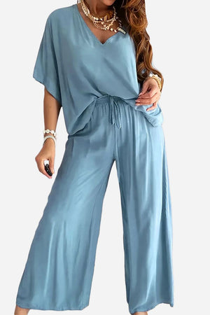 Blue two-piece pantsuit with V-neck top and wide-leg pants for women