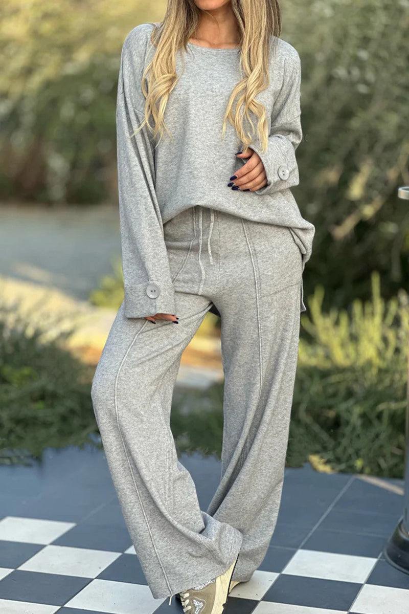 Gray relaxed fit two-piece set with wide-leg pants and button-cuff sweater for comfortable, wrinkle-resistant travel wear