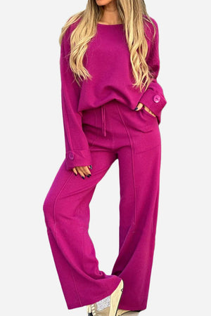 Comfortable travel-ready magenta two-piece set with wide-leg pants and button-cuff sweater.