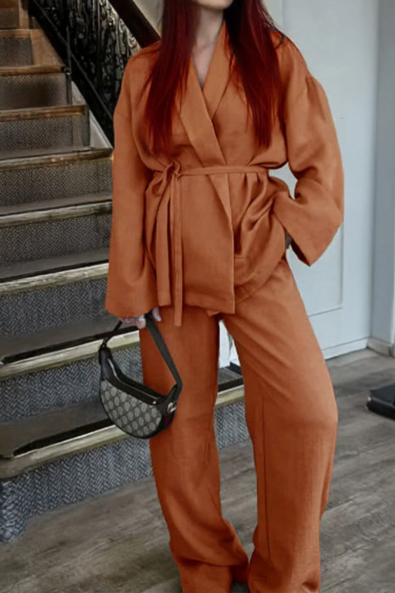 Rusty orange wide-leg pants and belted top in cozy Mix-Match Lounge-to-Travel Set for stylish comfort.