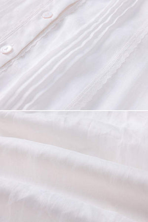 close-up of white 100% linen fabric with button and pleated details for coastal shift dress