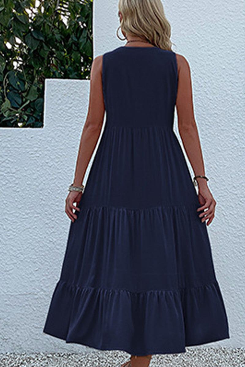 Woman wearing navy blue Bohemian Tiered Midi Dress standing outdoors with back view