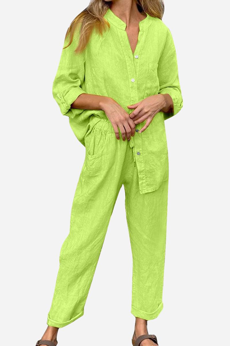 Woman wearing lime green casual chic two-piece set with long sleeves and relaxed fit pants against white background
