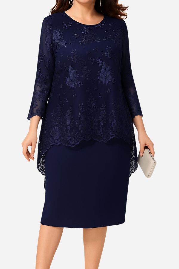 Navy two-piece evening dress with elegant lace details and embroidered top with high-low hem.