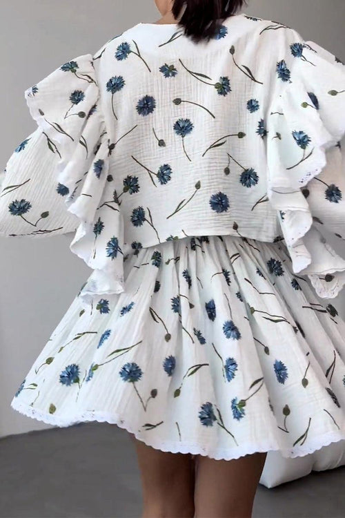 Woman wearing Sweet Countryside 100 Cotton white two-piece set with blue floral print and ruffled design