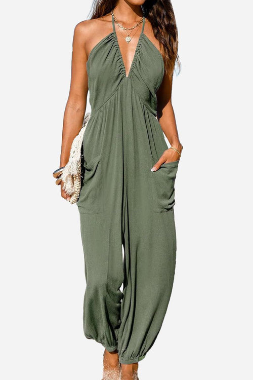 green halter-neck wide-leg jumpsuit with pockets and elastic ankle cuffs sunshine on sand style