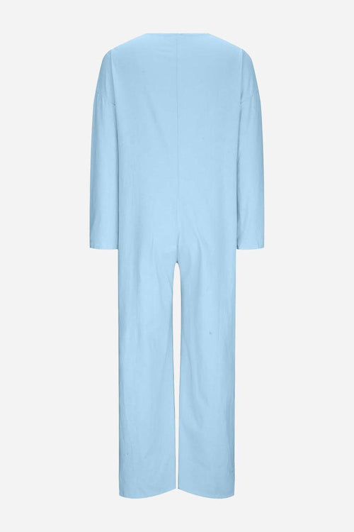 Light blue relaxed jumpsuit with long sleeves and wide legs, back view