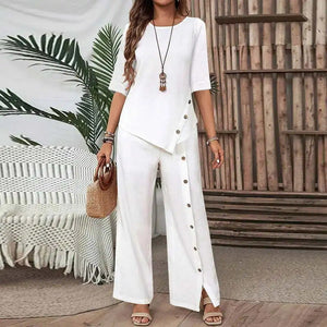 woman wearing white asymmetry flow co-ord with button-front top and flowing long pants, casual stylish outfit