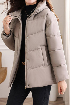 Lightweight Everyday Warmth Coat mid-length hooded jacket with 5-layer insulation and wind-resistant shell in beige.