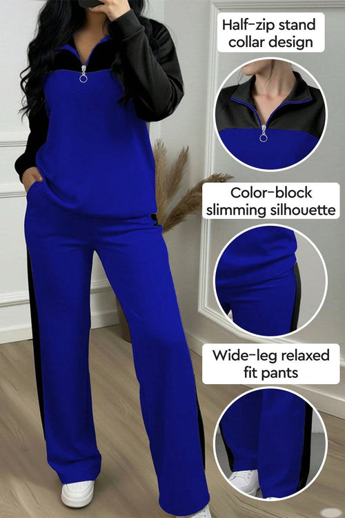 Woman wearing blue and black colorblock comfort leisure set with half-zip stand collar and wide-leg pants
