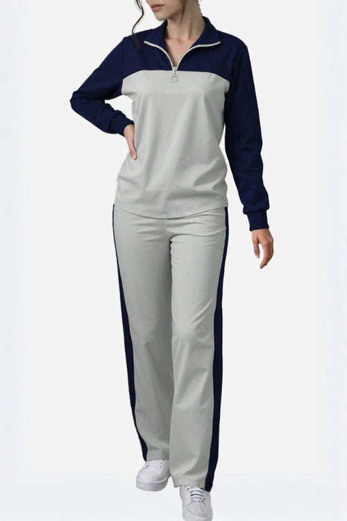 Woman wearing Colorblock Comfort Leisure Set with navy and gray half-zip top and wide-leg pants