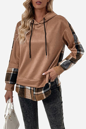 Brown countryside layered hoodie with plaid accents on hem, cuffs, and sleeves worn by a model