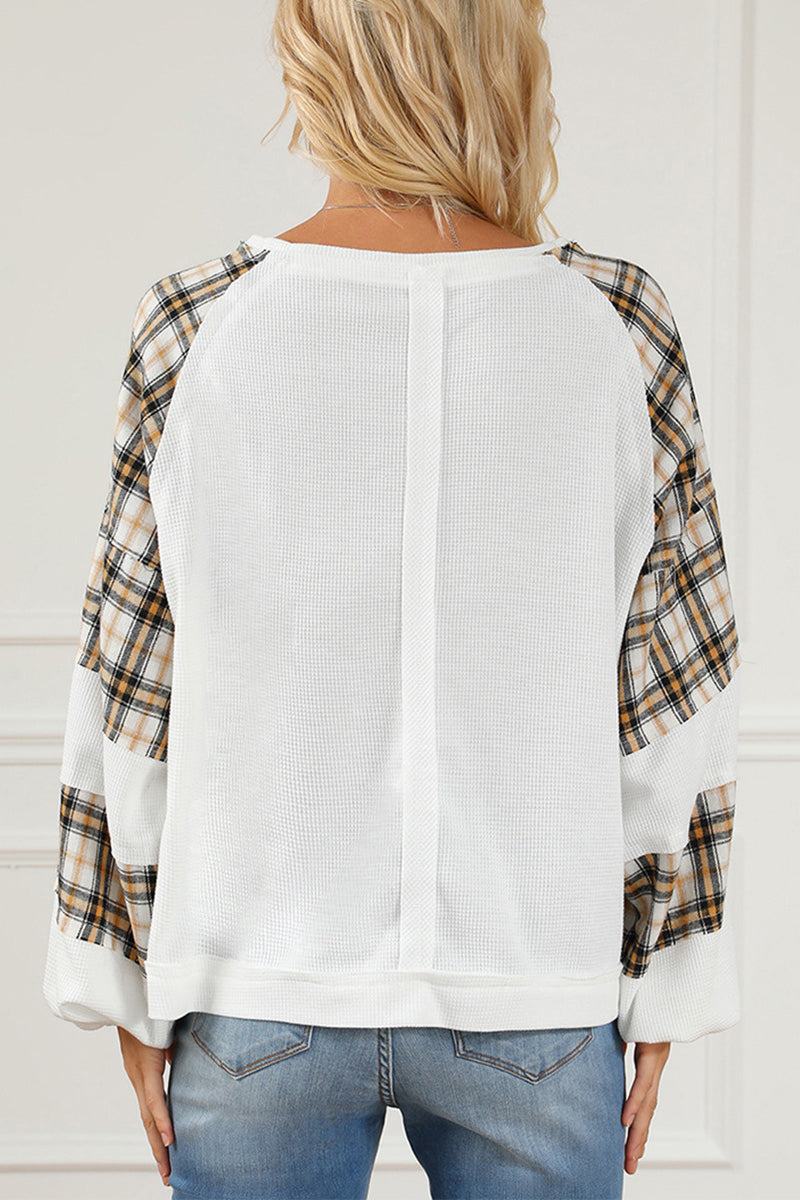 Waffle knit sweatshirt with white textured body and plaid flannel sleeves, relaxed fit back view