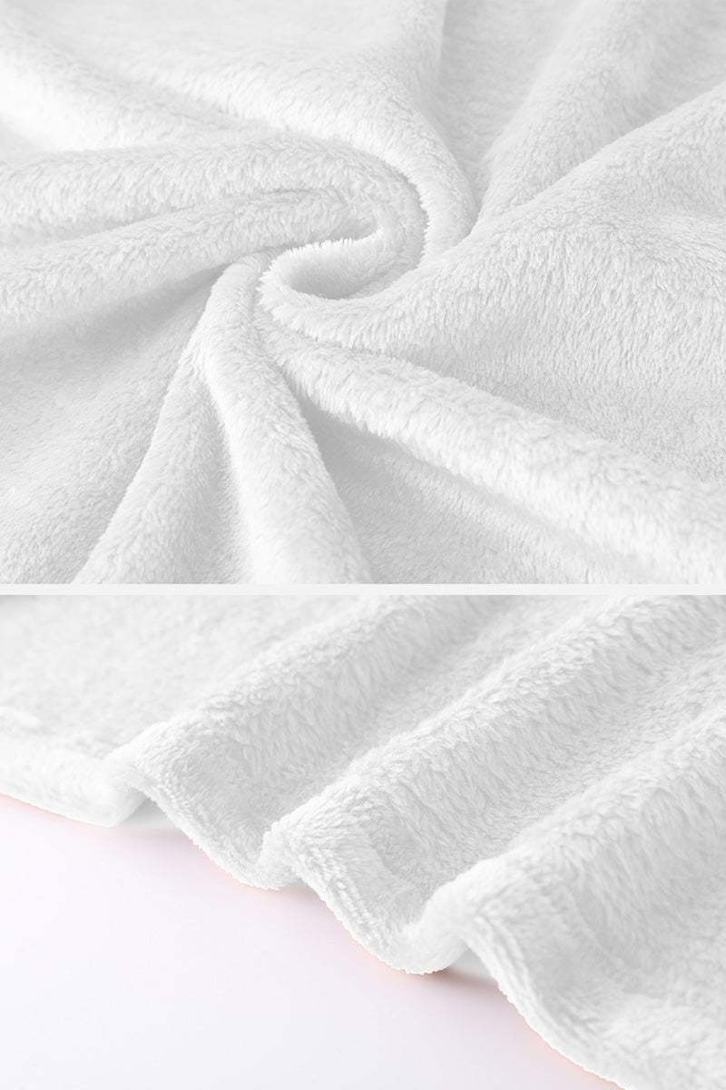 Close-up texture of soft white plush faux fur fabric for open front oversized fur jacket