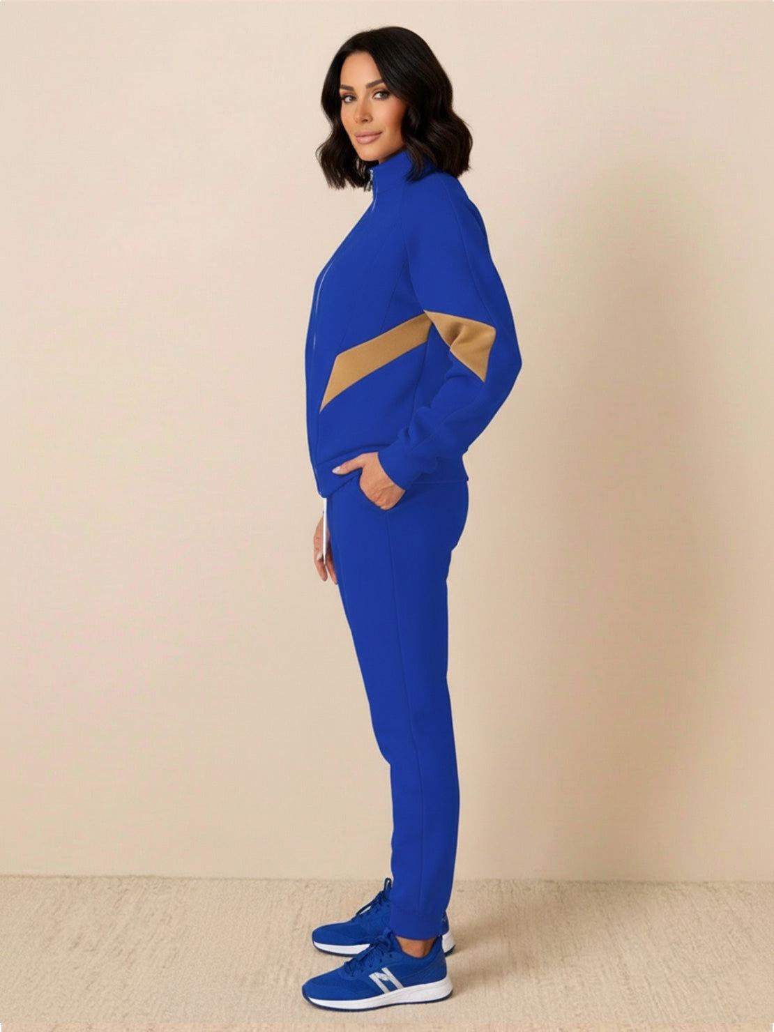 Woman wearing a Colorblock Comfort Tracksuit with contrast curved panels and relaxed fit