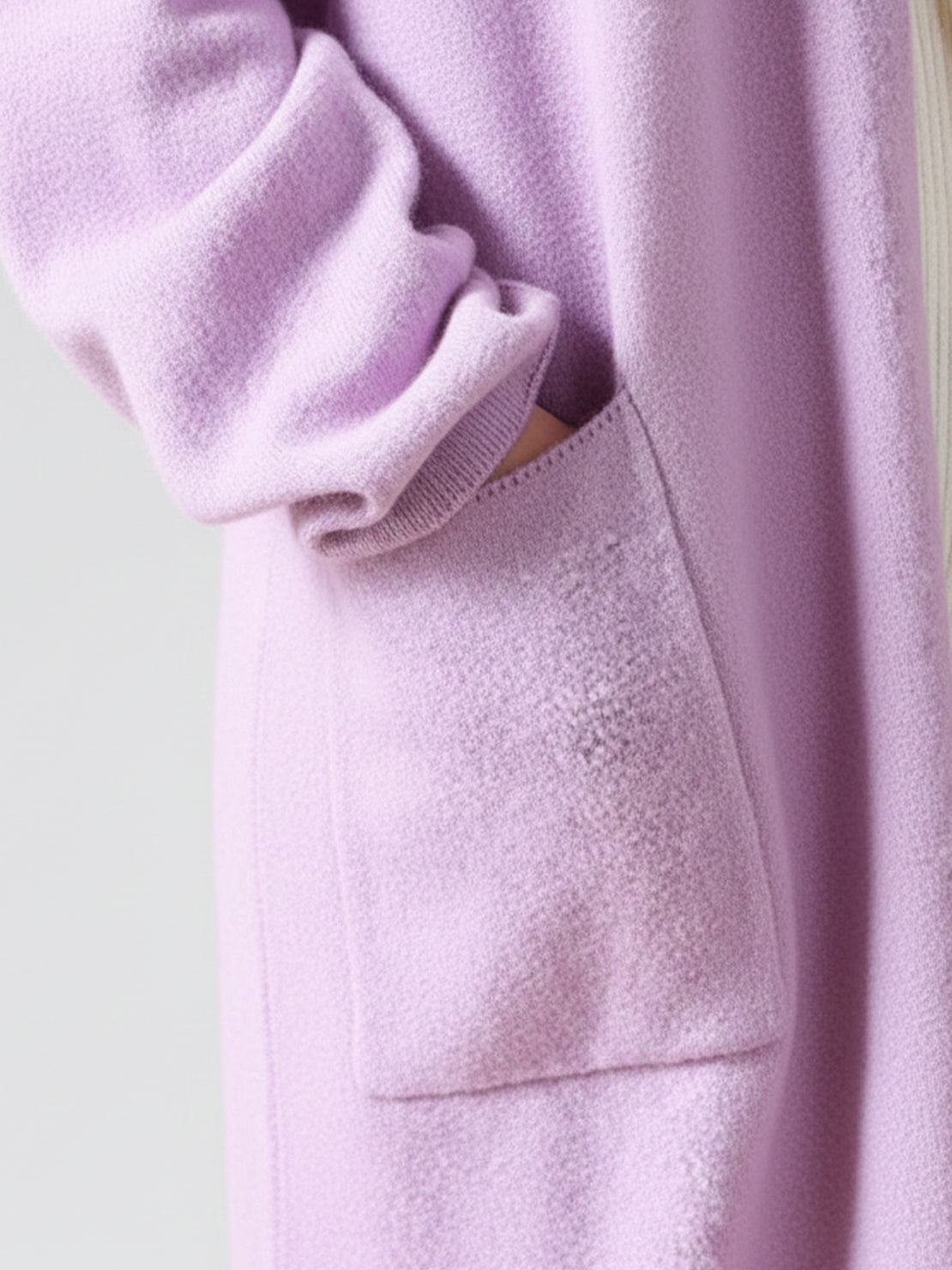 Long Australian Merino Wool cardigan with open front and patch pockets, ideal for layering in cooler seasons.