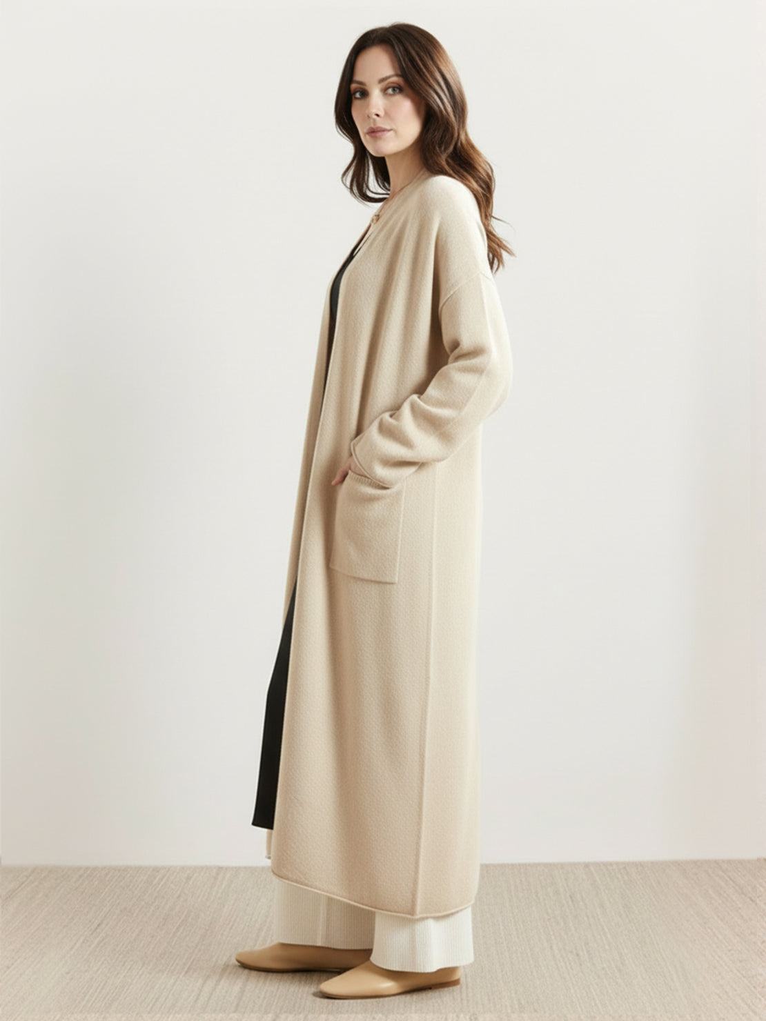 100% Australian Merino Wool longline open-front cardigan with patch pockets and ribbed cuffs