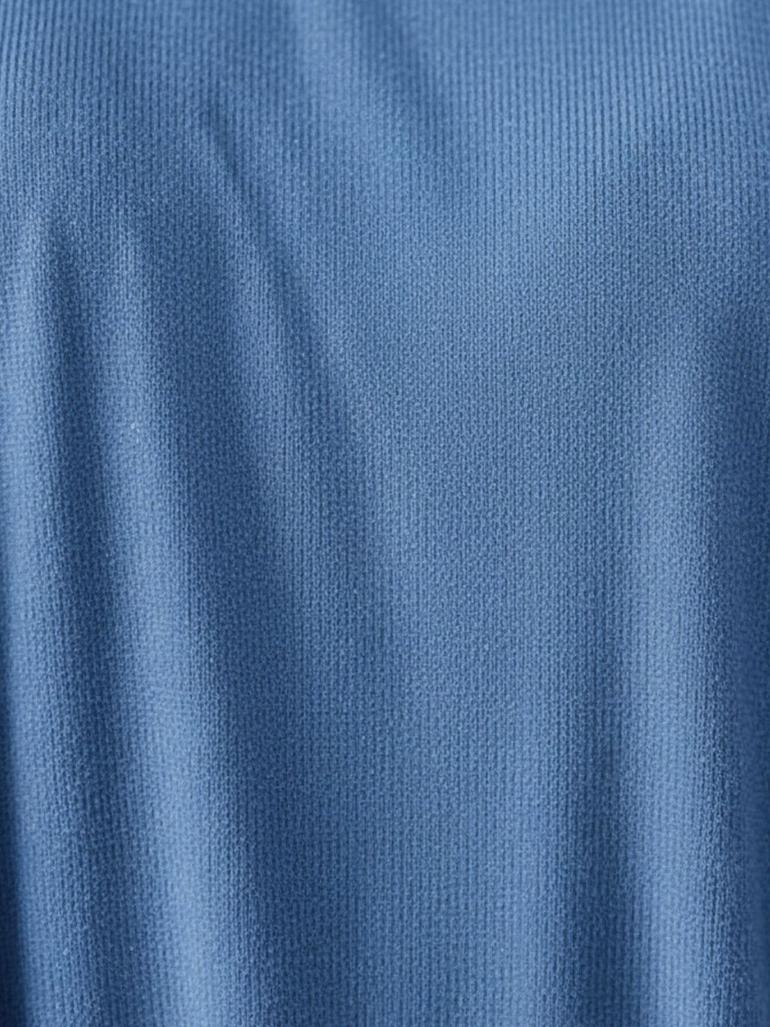 Woman wearing oversized long-line loungewear set with pullover and straight-leg pants