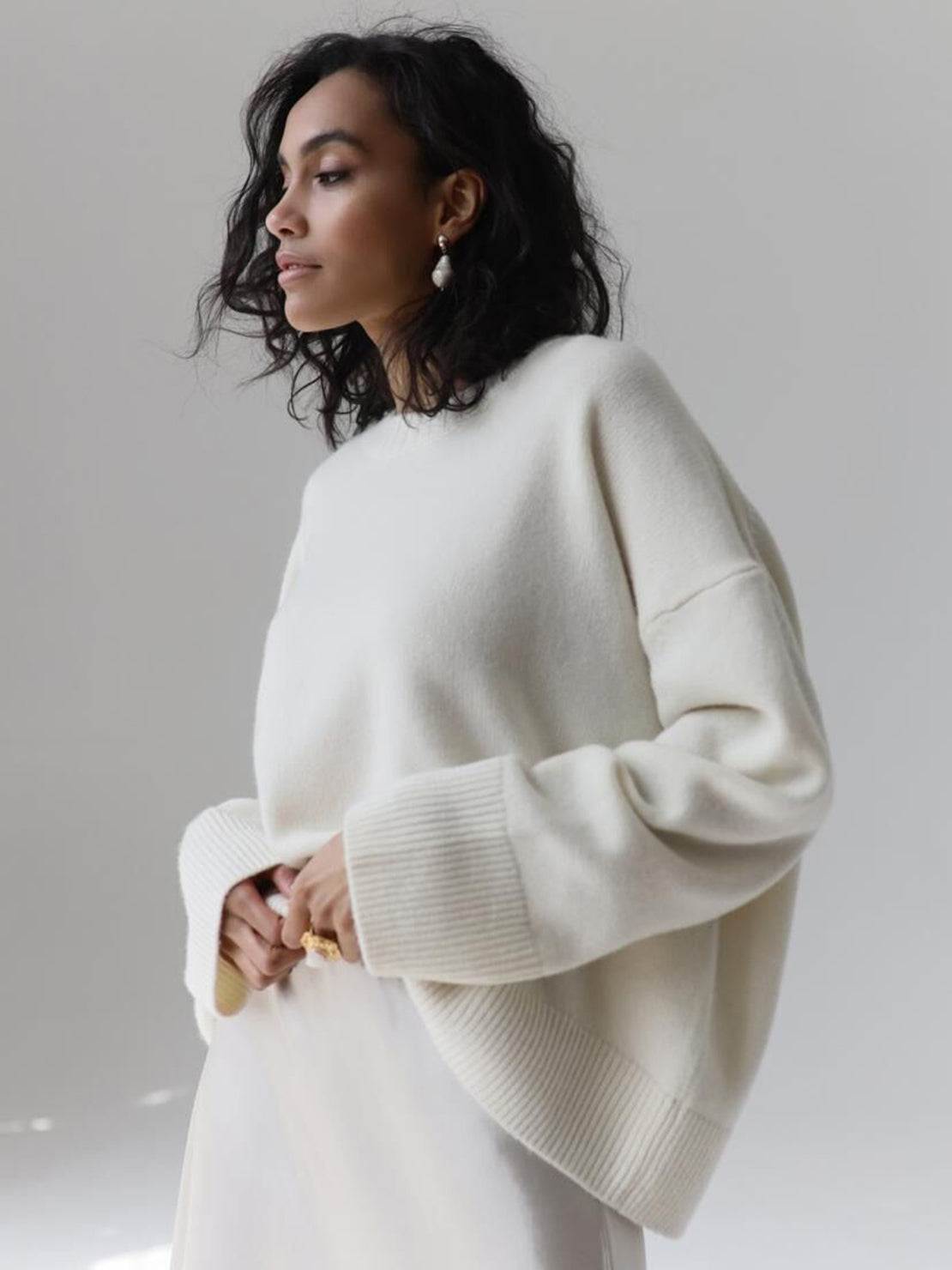 Oversized crew neck knit sweater with drop-shoulder sleeves and ribbed cuffs