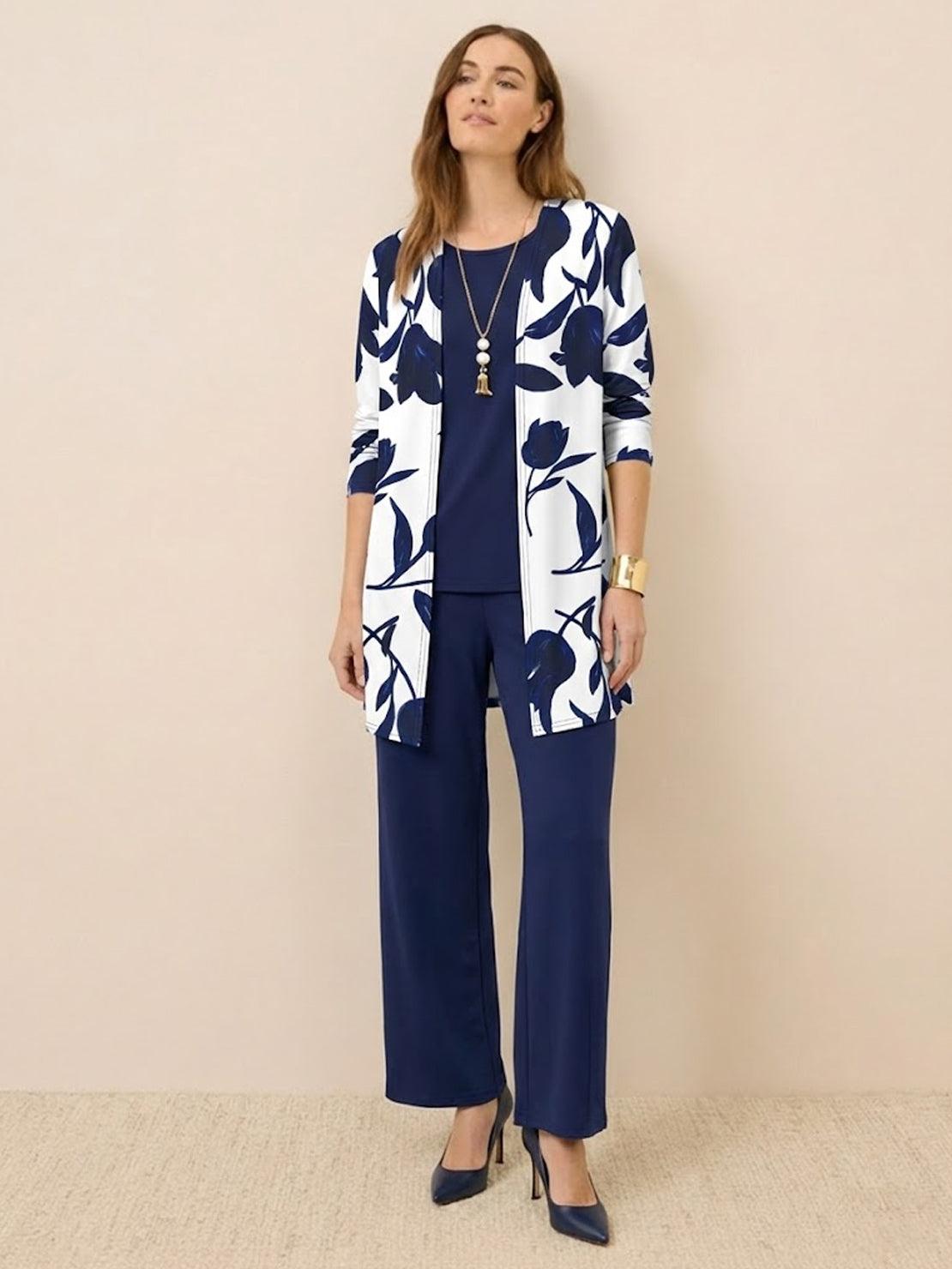 Woman wearing open-front three-piece co-ord with longline cardigan, tank top, and wide-leg trousers in lightweight knit fabric