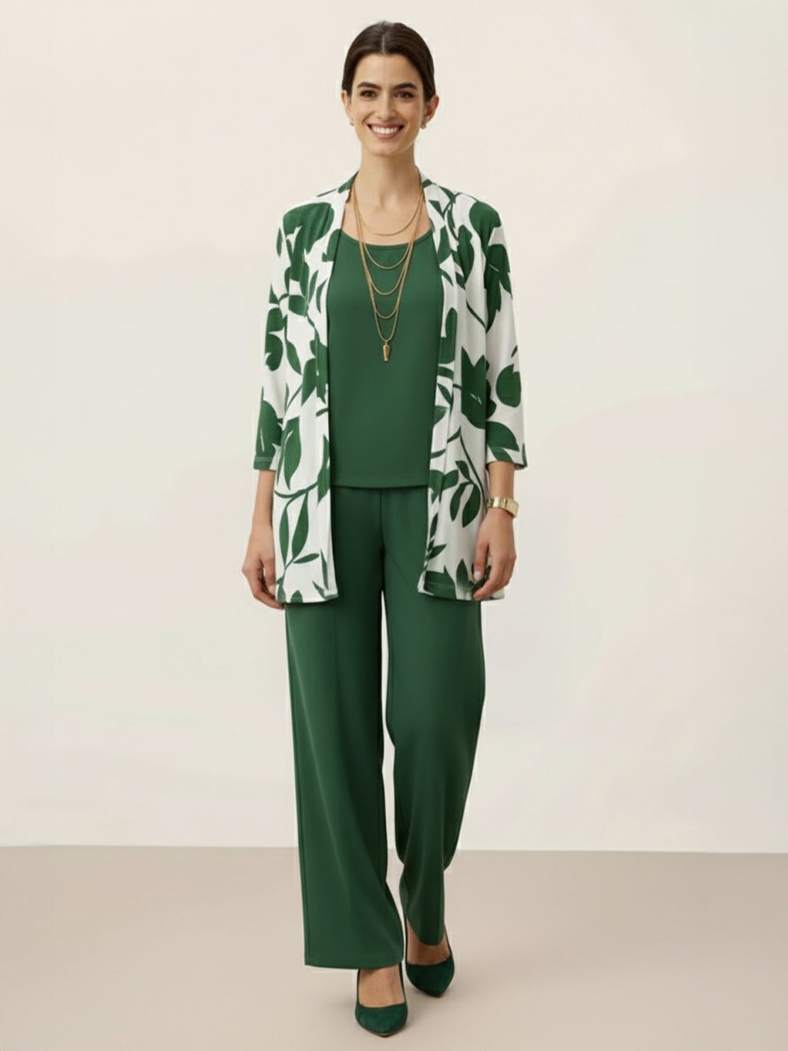 Woman wearing open-front three-piece co-ord set with longline cardigan, tank top, and wide-leg trousers