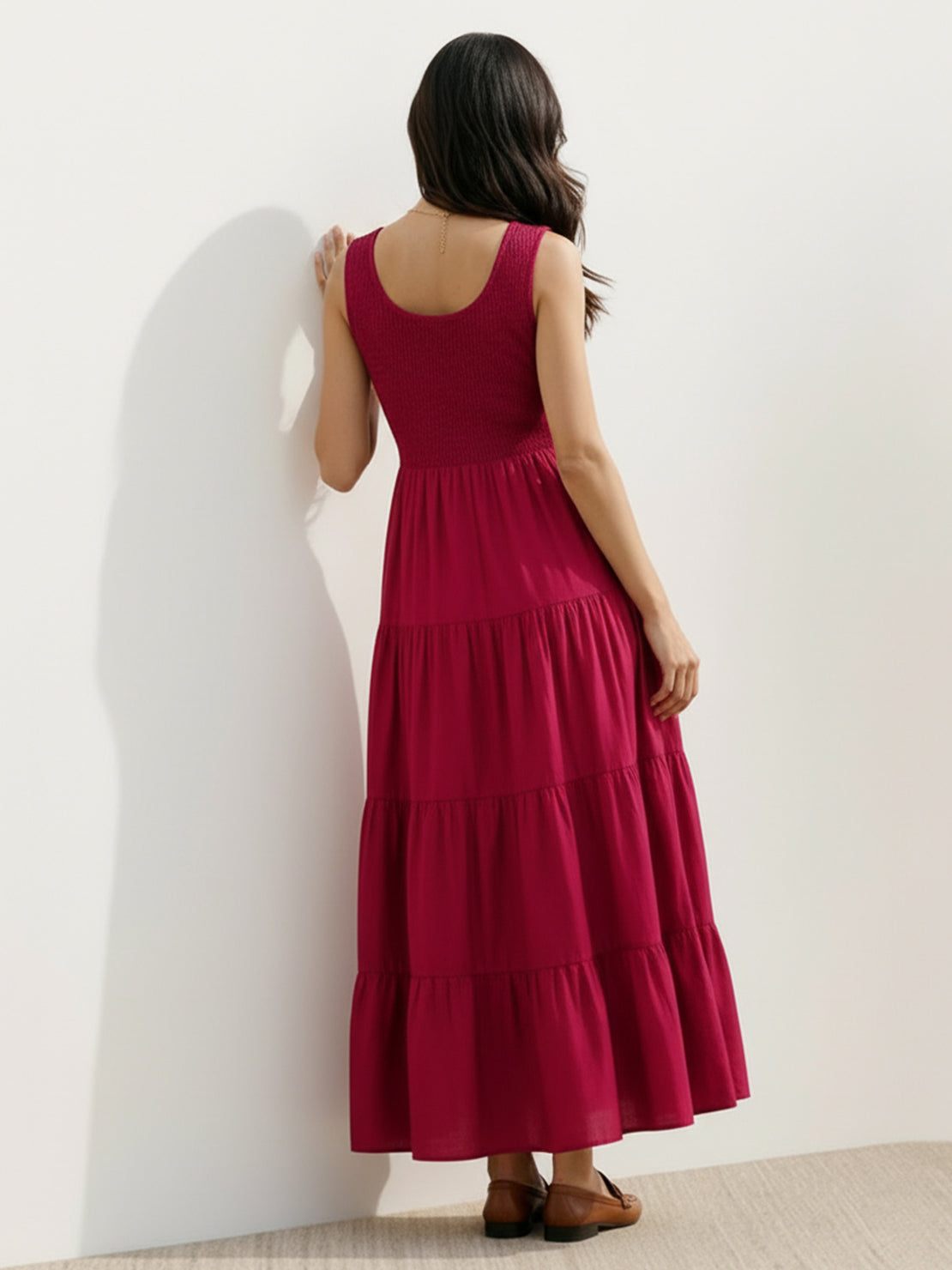 Smocked sleeveless maxi dress with tiered skirt and scoop neckline