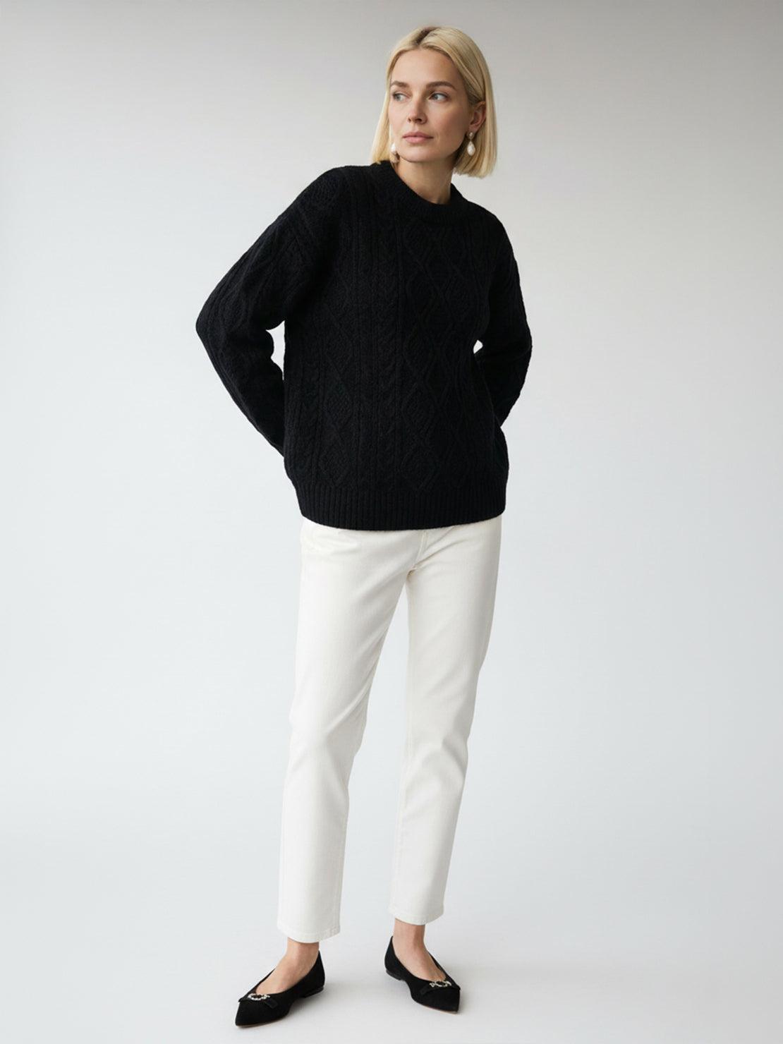 Oversized cable-knit crewneck sweater with dropped shoulders and diamond rope pattern