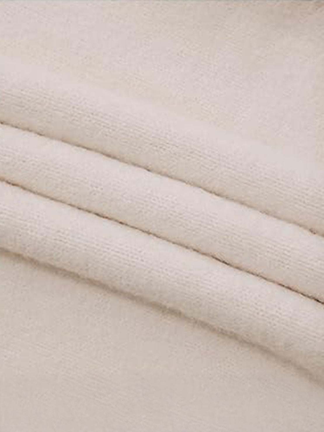 Oversized cable-knit crewneck sweater with dropped shoulders and ribbed trim