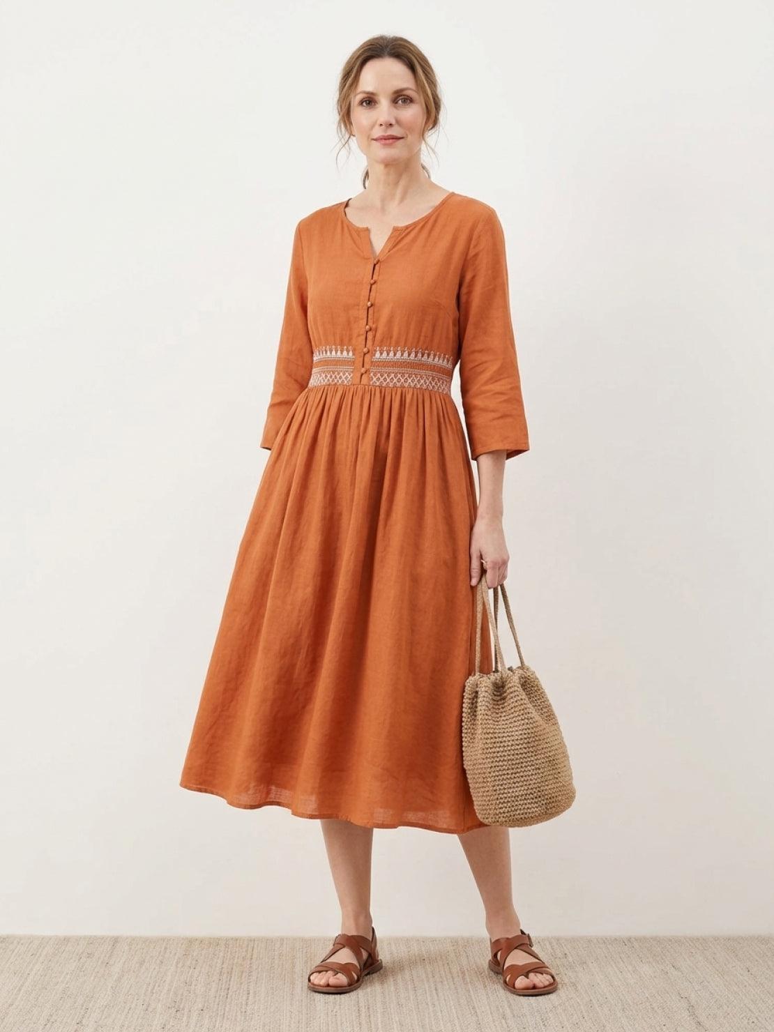Rusty orange cotton linen midi dress with smocked waist and folk-art embroidery