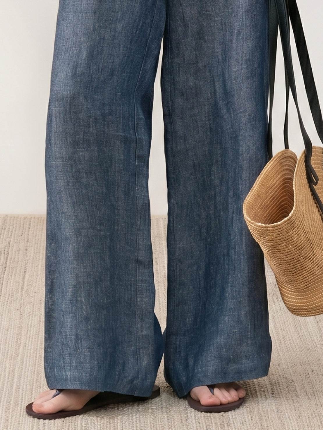 Wide palazzo pants in pure linen yarn-dyed fabric with high-rise waist and relaxed floor-length drape