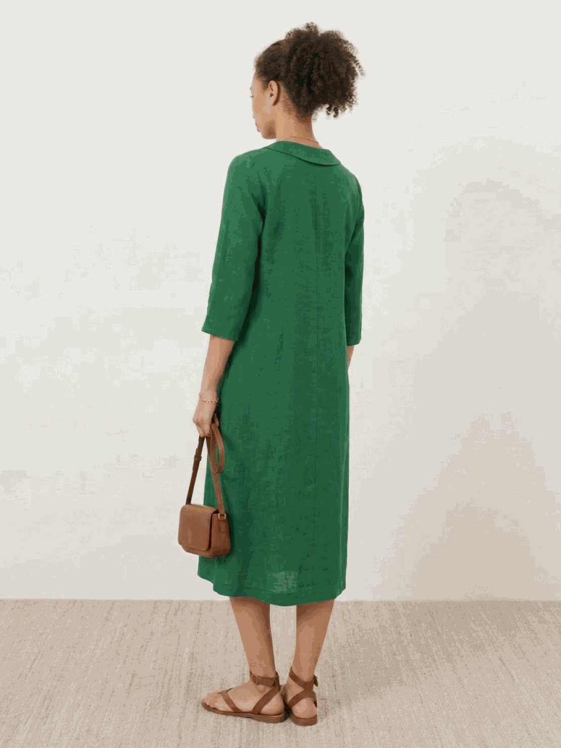 Navy linen-look midi dress with relaxed A-line fit, V-neckline, button detail, 3/4 sleeves, and side pockets