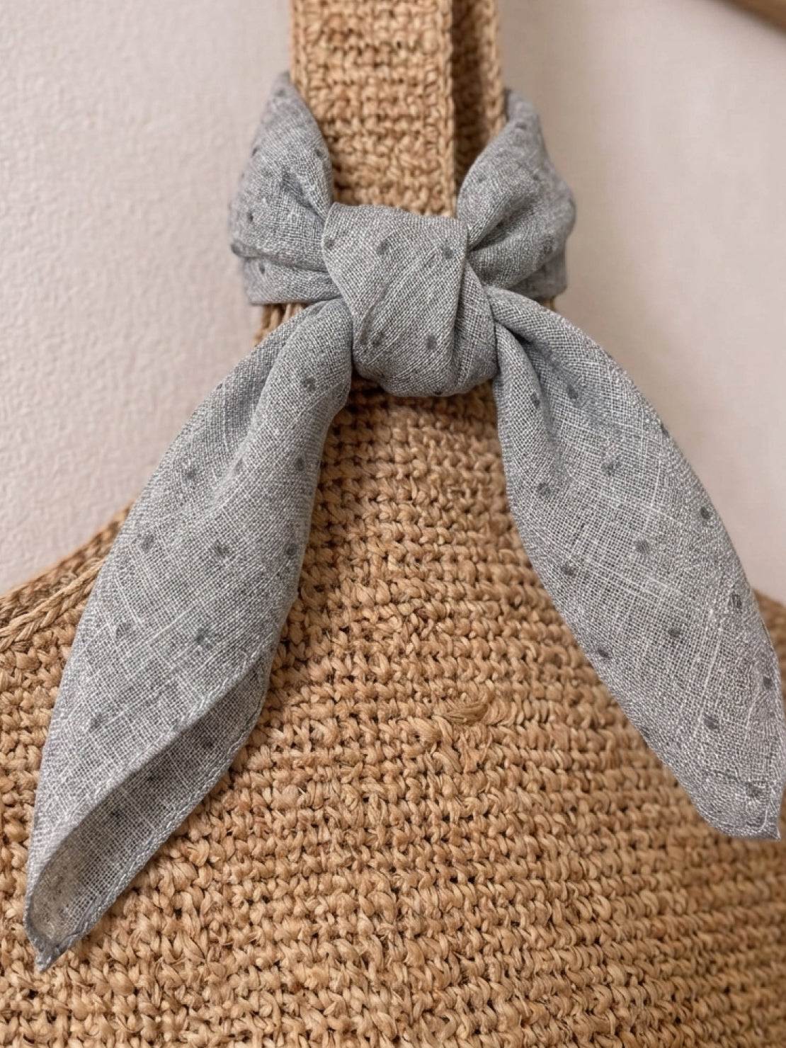 Lightweight 100% linen neck scarf with timeless checkered pattern and natural rolled edges