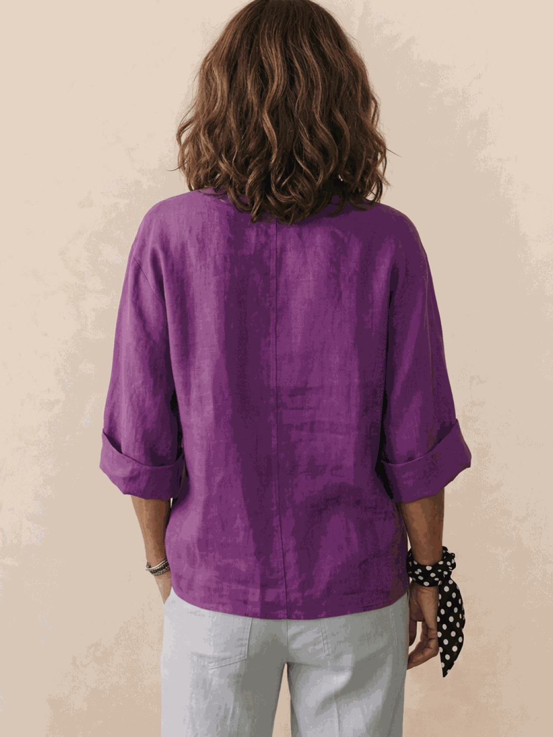 woman wearing pure linen age-defying shirt with button detail in white on a plain background